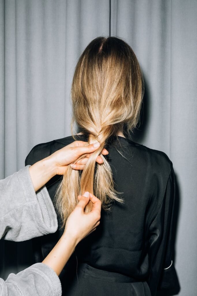 back view of a person with blonde hair